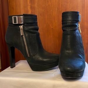 Black leather platform booties.